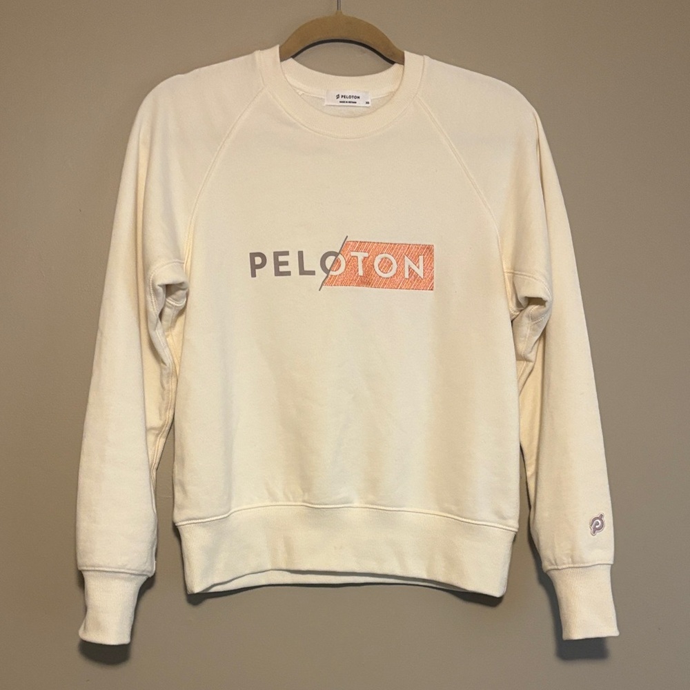 Peloton Cream Crew Sweatshirt with Orange Logo - XS